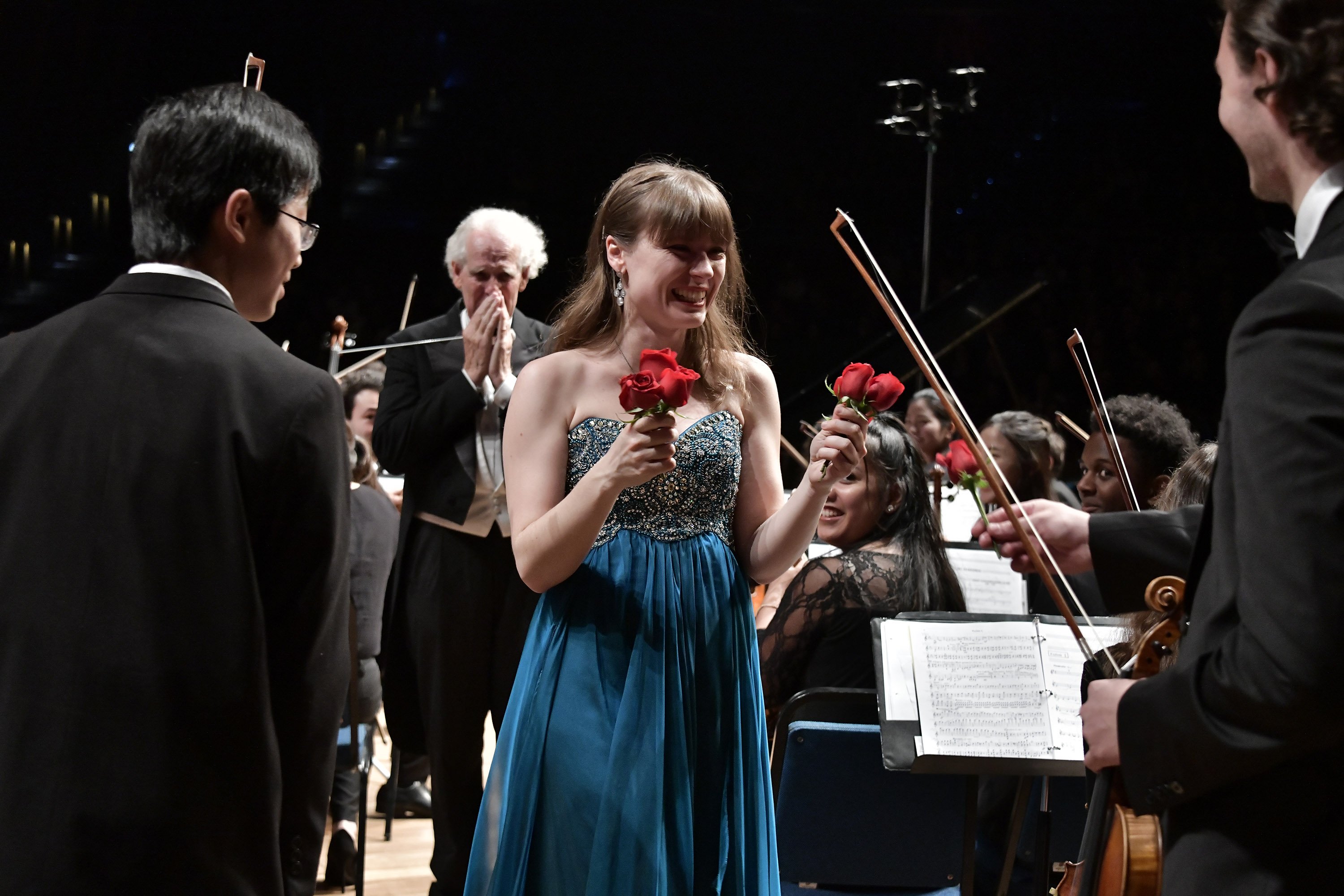 Anna Federova receives roses from the violinists.