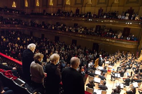 The Boston Philharmonic Youth Orchestra plays the Ukraine National Anthem while the audience stands